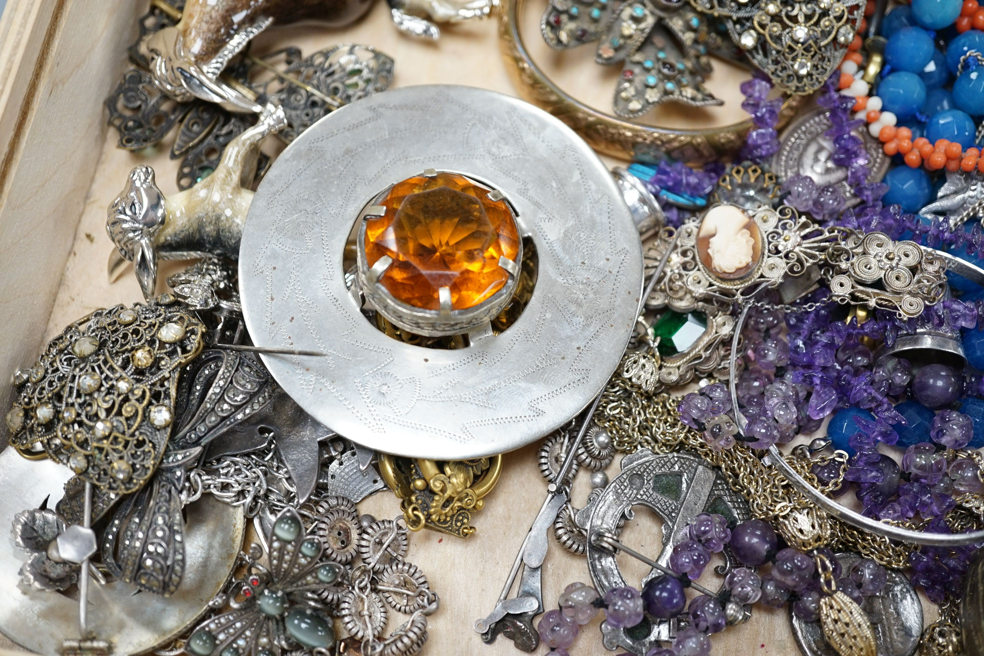 A group of assorted mostly costume jewellery including a Scottish brooch